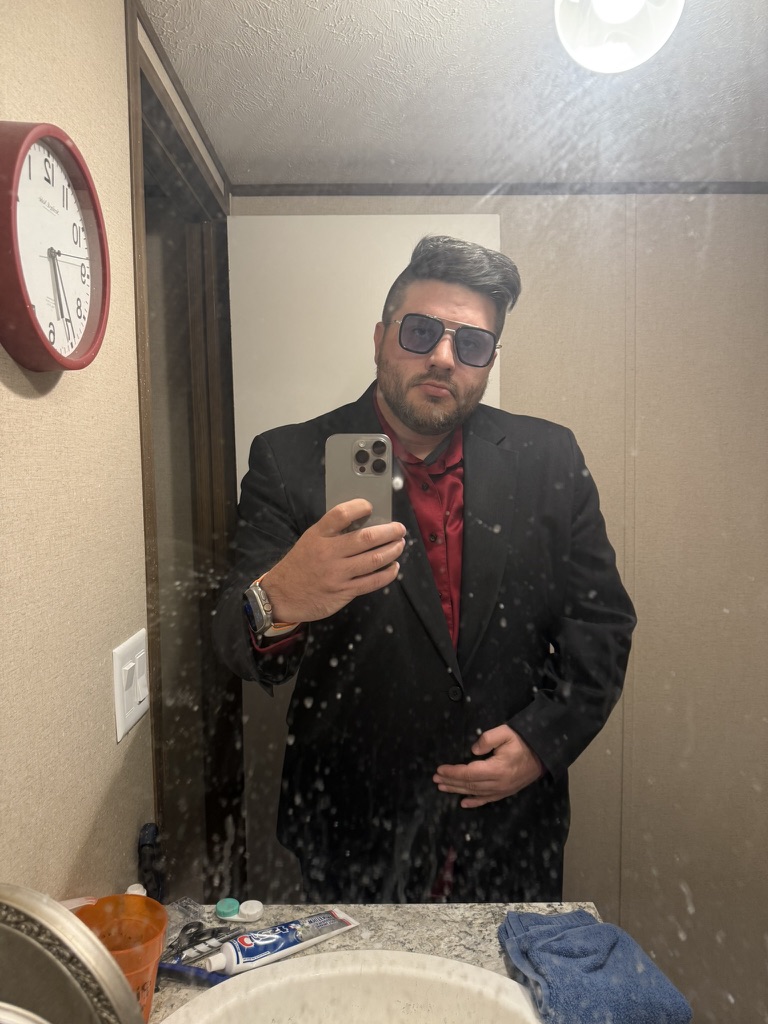 Shawn Lopp taking a suit mirror photo with an iPhone