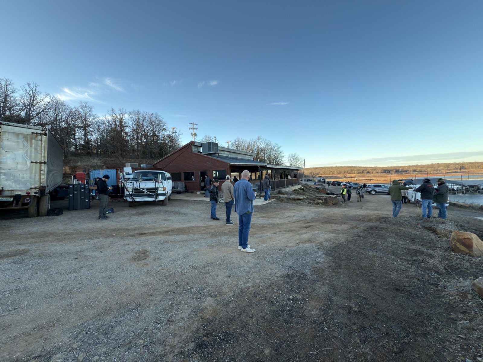 A wide view of the lakeside restaurant filming location and production activity