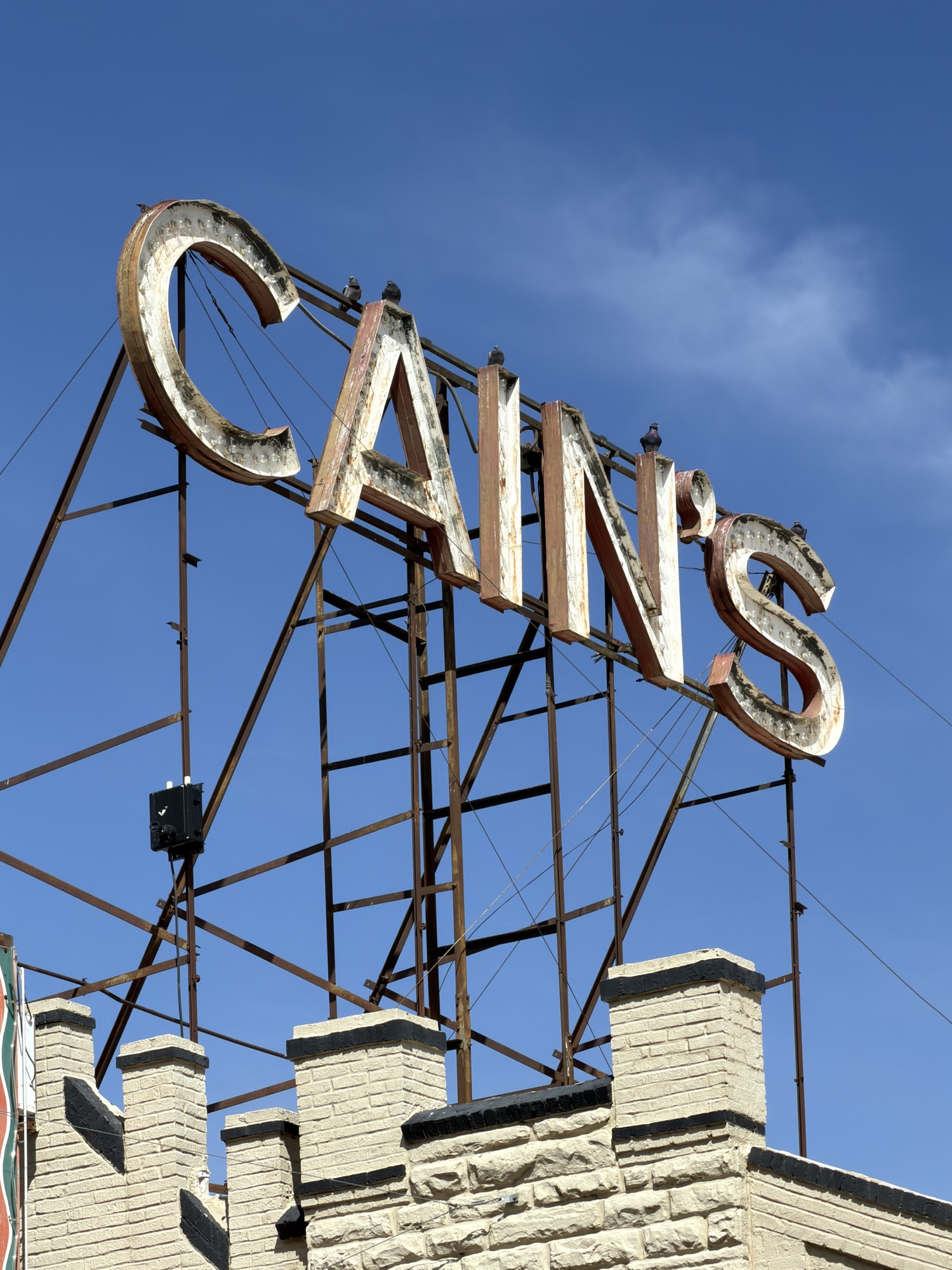 The historic Cain’s sign against a blue sky